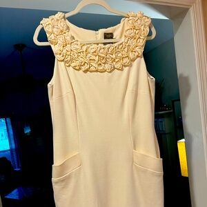 Size 12 Vintage inspired dress. Rose lapel and pockets on each hip. Zipper back